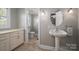 Elegant bathroom with pedestal sink and toilet at 3044 Old Church Rd, Gastonia, NC 28052