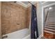 Bathroom with shower/tub combo and access to stairs at 3044 Old Church Rd, Gastonia, NC 28052