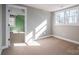 Well-lit bedroom featuring sunny window and access to another room at 3044 Old Church Rd, Gastonia, NC 28052