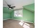 Bright bedroom with two windows and a ceiling fan at 3044 Old Church Rd, Gastonia, NC 28052