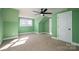 Spacious bedroom with a ceiling fan and large window at 3044 Old Church Rd, Gastonia, NC 28052