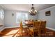 Formal dining room featuring hardwood floors and a chandelier at 3044 Old Church Rd, Gastonia, NC 28052