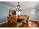 Bright dining room with hardwood floors and a large table at 3044 Old Church Rd, Gastonia, NC 28052