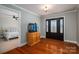 Bright entryway with hardwood floors and a view into a bedroom at 3044 Old Church Rd, Gastonia, NC 28052