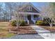 Two-story home with wraparound porch and landscaping at 3044 Old Church Rd, Gastonia, NC 28052