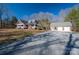 Two story home with attached garage and gravel driveway at 3044 Old Church Rd, Gastonia, NC 28052