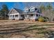 Attractive residence boasting a large front porch, ideal for entertaining guests at 3044 Old Church Rd, Gastonia, NC 28052