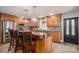 Bright kitchen with an island, stainless steel appliances, and dark wood cabinets at 3044 Old Church Rd, Gastonia, NC 28052