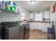 Laundry room with washer, dryer, and cabinets at 3044 Old Church Rd, Gastonia, NC 28052