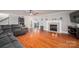 Spacious living room featuring hardwood floors and a cozy fireplace at 3044 Old Church Rd, Gastonia, NC 28052