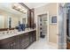 Elegant bathroom with double vanity, marble floors, and modern fixtures at 3421 Walston Ln, Charlotte, NC 28211