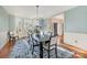 Elegant dining room with a bay window, refined wainscoting, and a stylish chandelier at 3421 Walston Ln, Charlotte, NC 28211