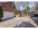 Spacious driveway leading to a two-car garage, with a sports court visible in the background at 3421 Walston Ln, Charlotte, NC 28211