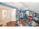 Home gym featuring hardwood floors and modern exercise equipment at 3421 Walston Ln, Charlotte, NC 28211