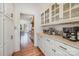 Butler's pantry with marble countertops, white cabinetry, and stainless steel appliances at 3421 Walston Ln, Charlotte, NC 28211