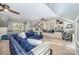 Spacious living room with a large blue sectional and custom built-in shelving at 3421 Walston Ln, Charlotte, NC 28211