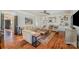 Comfortable living room with hardwood floors, an area rug, and a fireplace with built-in shelving at 3421 Walston Ln, Charlotte, NC 28211