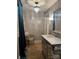 Bathroom with mirrored vanity and chandelier at 35 Marsh Ave, Wadesboro, NC 28170