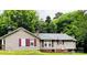 House exterior showcases a tan siding and maroon shutters at 35 Marsh Ave, Wadesboro, NC 28170