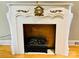 Ornate fireplace with gold detailing and electric insert at 35 Marsh Ave, Wadesboro, NC 28170