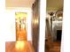 Long hallway with hardwood floors and a rustic barn door at 35 Marsh Ave, Wadesboro, NC 28170