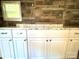 White kitchen cabinets with granite countertops at 35 Marsh Ave, Wadesboro, NC 28170