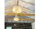 Two crystal chandeliers in a room with exposed beams at 35 Marsh Ave, Wadesboro, NC 28170