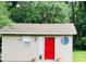 Small studio with red door and unique window at 35 Marsh Ave, Wadesboro, NC 28170