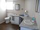 Bathroom with single vanity, toilet and corner sink at 3935 Tower Rd, Maiden, NC 28650