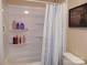 Shower with shelves and striped shower curtain at 3935 Tower Rd, Maiden, NC 28650