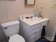 Simple bathroom with toilet, vanity, and a small mirror at 3935 Tower Rd, Maiden, NC 28650