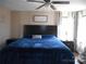 King-size bed and ceiling fan in main bedroom at 3935 Tower Rd, Maiden, NC 28650