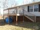 Wooden deck with stairs leading to ground level at 3935 Tower Rd, Maiden, NC 28650