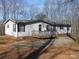 Ranch style home with deck, situated on a wooded lot at 3935 Tower Rd, Maiden, NC 28650