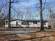 Ranch style home with gray siding and wood front door at 3935 Tower Rd, Maiden, NC 28650