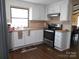 Stainless steel appliances and white cabinets at 3935 Tower Rd, Maiden, NC 28650