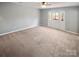 Spacious bedroom with neutral carpeting and access to outdoor space at 4127 Bon Rea Dr, Charlotte, NC 28226