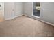 Well-lit bedroom with carpet and neutral-colored walls at 4127 Bon Rea Dr, Charlotte, NC 28226