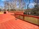 Spacious red deck overlooks a wooded backyard at 4127 Bon Rea Dr, Charlotte, NC 28226