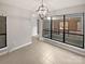 Bright dining area with tile floors and a view to the backyard at 4127 Bon Rea Dr, Charlotte, NC 28226