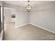 Dining room with tile floors and modern light fixture at 4127 Bon Rea Dr, Charlotte, NC 28226