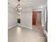 Spacious entryway with tile floors and an orange door at 4127 Bon Rea Dr, Charlotte, NC 28226