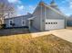 Gray house with white garage door and landscaping at 4127 Bon Rea Dr, Charlotte, NC 28226