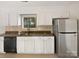 Kitchen boasts white cabinets, granite countertops, and stainless steel appliances at 4127 Bon Rea Dr, Charlotte, NC 28226