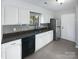 Kitchen with white cabinets, granite countertops, and stainless steel appliances at 4127 Bon Rea Dr, Charlotte, NC 28226