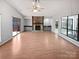 Living room with hardwood floors and stone fireplace at 4127 Bon Rea Dr, Charlotte, NC 28226