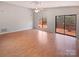 Living room with hardwood floors and sliding glass doors to deck at 4127 Bon Rea Dr, Charlotte, NC 28226