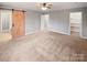 Spacious main bedroom with carpeted floors and barn door at 4127 Bon Rea Dr, Charlotte, NC 28226