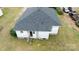 Aerial view of the home's backyard with the roof and yard, set in a grassy area at 504 Glasgow Rd, Charlotte, NC 28214