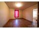 Bright bedroom with hardwood floors, a window, and a spacious layout at 504 Glasgow Rd, Charlotte, NC 28214